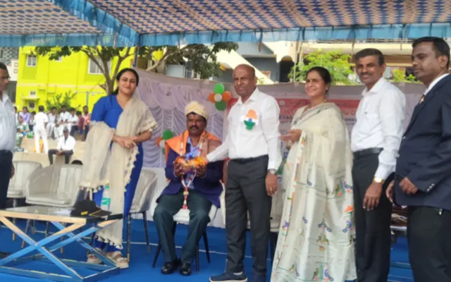 School management felicitating a guest with a trophy on the Independence Day dais